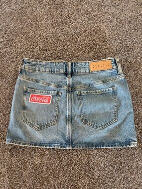 Pacific Sunwear Light Blue Denim Mini Skirt with Red Coca-Cola Patch